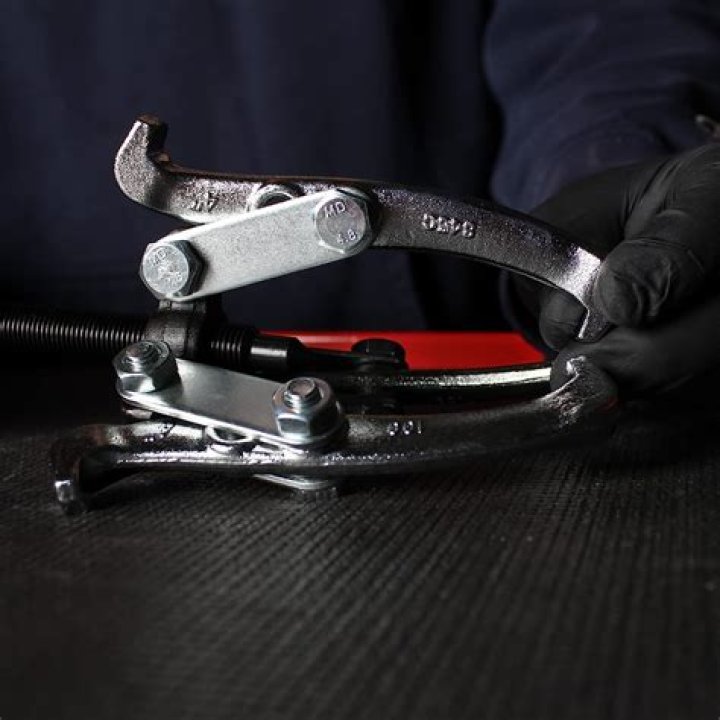 How do you use a slide hammer seal puller?