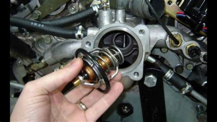 Where is the thermostat located on a 2004 Chevrolet Impala?